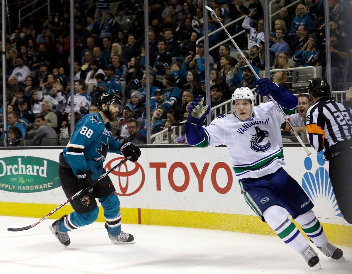 Vancouver Canucks center Bo Horvat celebrates after scoring a goal in front of San Jose Sharks defenseman Brent Burns during the second period. 