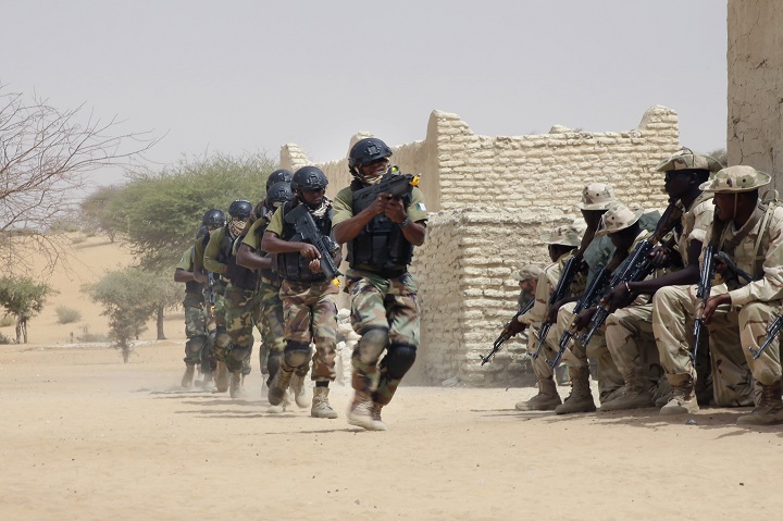 Nigerian special forces run past Chadian troops in an hostage rescue exercise at the end of the Flintlock exercise in Mao, Chad, Saturday, March 7, 2015. The U.S. military and its Western partners conduct this training annually and set up plans long before Boko Haram began attacking its neighbors Niger, Chad and Cameroon.