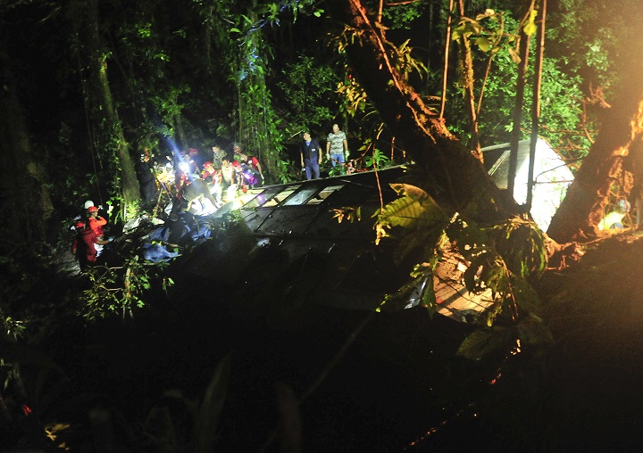 Rescue personnel work at the site where a tourist bus crashed, killing at least 49 people, according to the the Santa Catarina State security secretary, near the city of Joinville, southern state of Santa Catarina, Brazil, Saturday, March 14, 2015.