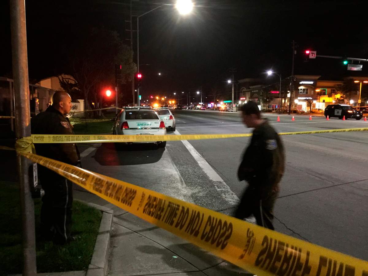 Law enforcement officers have an area blocked off as they search for a suspect in the fatal shooting of a San Jose, Calif., police officer Tuesday, March 24, 2015. 