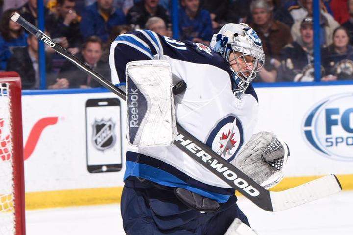 Ondrej Pavelec of the Winnipeg Jets makes a save against the St. Louis Blues on Tuesday.