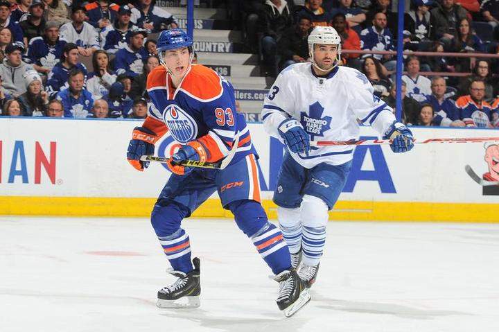 Ryan Nugent-Hopkins #93 of the Edmonton Oilers and Nazem Kadri #43 of the Toronto Maple Leafs skate on the ice on March 16, 2015 at Rexall Place in Edmonton, Alberta, Canada.