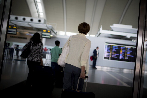 Travelers enter Toronto Pearson International Airport in Toronto, Ontario, Canada, on Wednesday, July 3, 2013.