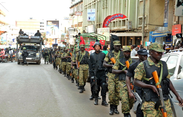 UPDF soldiers and police forces patrol streets in Kampala with a tactical operation vehicle on July 3, 2014.