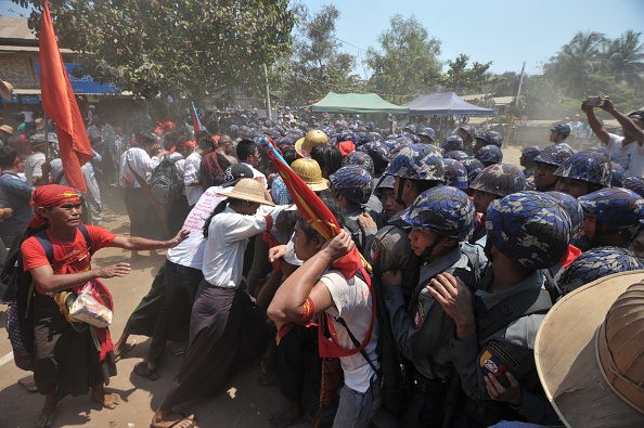 Myanmar student protesters and nationalists clash with riot police during a march in Letpadan town, some 130 kilometres (80 miles) north of Myanmar's main city on March 10, 2015. Student protesters have embarked on months of demonstrations calling for education reform, but plans by a core group to march to Yangon have been halted by police in the dusty central town of Letpadan, who have surrounded around 150 activists since March 2. 