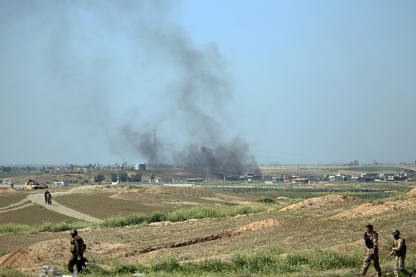 Kurdish Peshmerga forces  move to Sedde village 20 km far from Mulla Abdullah district, south of Kirkuk as they guard the area on March 10, 2015 during the ongoing clashes between Daesh (Islamic State of Iraq and the Levant) militants in Iraq. 