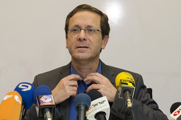 Israeli co-leader of the Zionist Union party and Labour Party's leader, Isaac Herzog listens during a joint press conference at the party headquarters in the Israeli coastal city of Tel Aviv on March 18, 2015 a day after the country's general election. After a closely-fought campaign, Israeli Prime Minister Benjamin Netanyahu's rightwing Likud party confounded the polls to win 30 of the 120 seats in parliament against 24 for rivals the centre-left Zionist Union. 