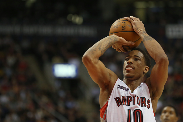 Raptors DeMar DeRozan has his tongue out as he shoots a foul shot. Toronto Raptors vs Houston Rockets in 2nd half action of NBA action at Air Canada Centre on March 30, 2015.