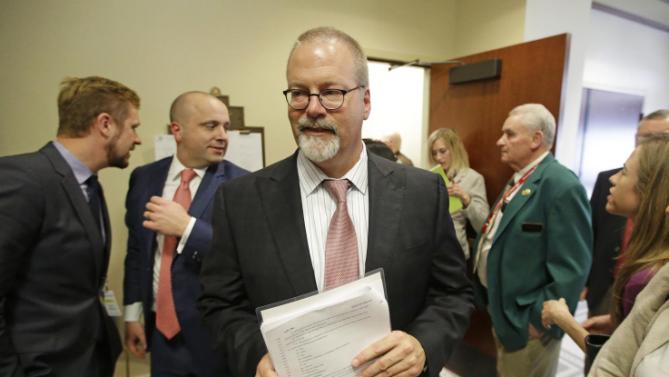 Sen. Stephen Urquhart, R-St. George, leaves a House committee hearing Tuesday, March 10, 2015, in Salt Lake City. An anti-discrimination bill protecting LGBT Utah residents and religious rights awaits a final vote by lawmakers. The bill was approved on Tuesday afternoon. It was originally scheduled for Monday, but postponed by the House Judiciary Committee after an hour-long hearing so that they could hear more comments from the public. (AP Photo/Rick Bowmer).