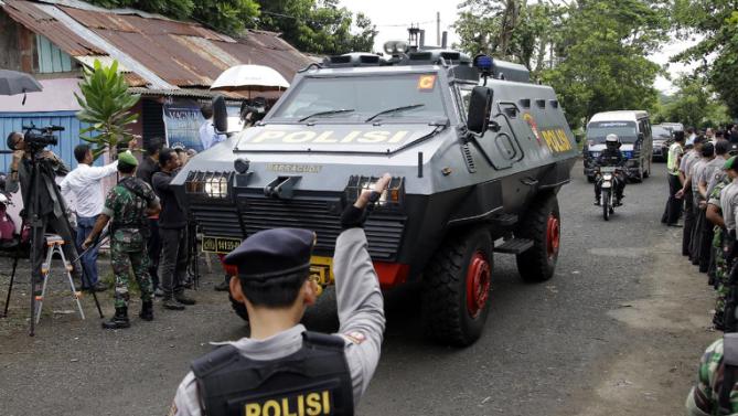 One of Indonesian police armored vehicles carrying two Australian prisoners arrives at Wijaya Pura port in Cilacap, Central Java, Indonesia, Wednesday, March 4, 2015. Indonesia began transferring the two Australians Andrew Chan and Myuran Sukumaran early Wednesday in preparation for the execution by firing squad of nine foreigners and an Indonesian condemned for drug smuggling, as diplomatic squabbles persist over the executions. 