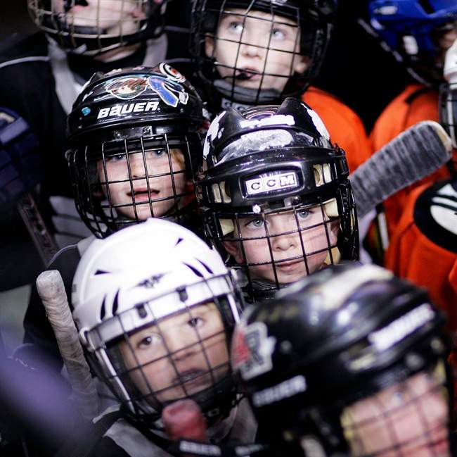 Young hockey players wait take to the ice, on Monday, Nov. 1, 2010, in Philadelphia, Pa.