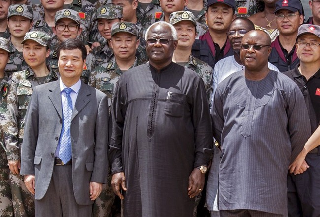 Sierra Leone's Vice President Samuel Sam-Sumana, seen centre right in Sept. 2014, has quarantined himself for 21 days following the death from Ebola last Tuesday Feb. 24, 2015, of one of his security personnel.