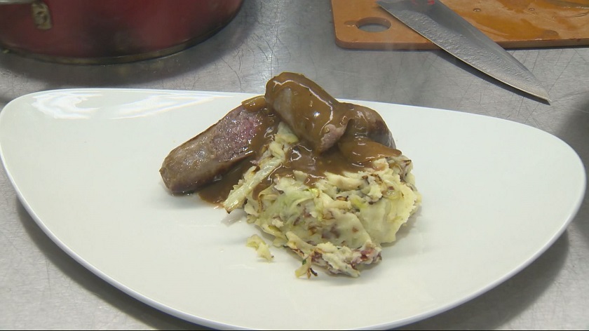 Chef Rob Thomas cooks up bangers and mash – Irish sausages and colcannon, or potatoes mashed with cabbage.