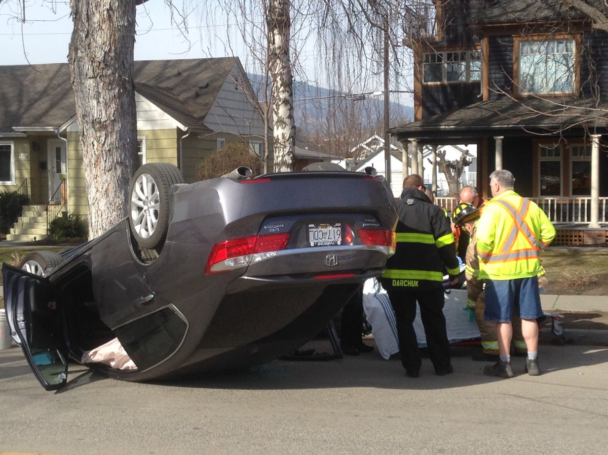 Car flips over in two vehicle crash in downtown Kelowna - image