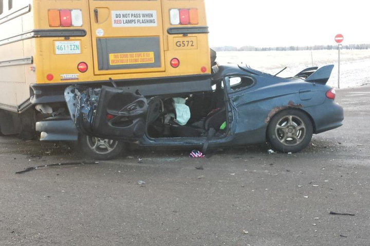 A school bus driver has been charged following a crash on the Trans-Canada Highway last January.