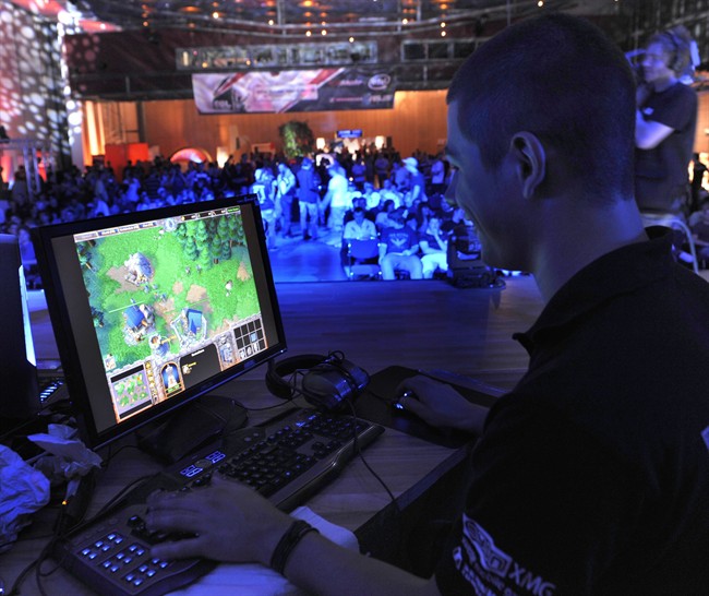 FILE - In this Aug. 7, 2009, file photo, a participant plays a computer game during the Intel Friday Night Game, a competition of the ESL, Electronic Sports League, in Dresden, Germany.