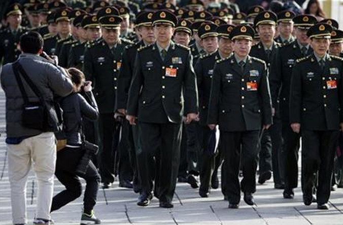 Chinese military officers arrive at the Great Hall of the People in Beijing Wednesday, March 4, 2015.
