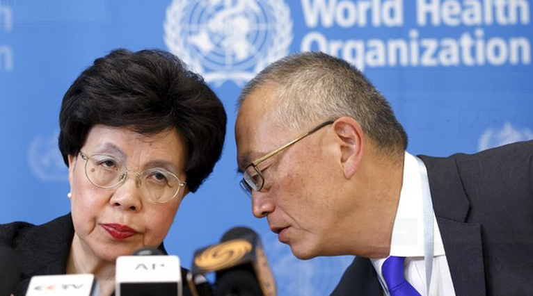 FILE - In this Friday, Aug. 8, 2014 file photo, Director-General of the World Health Organization (WHO) Dr. Margaret Chan, left, and Assistant Director-General of Health Security Keiji Fukuda, right, confer during a news conference after an emergency meeting at the WHO headquarters in Geneva, Switzerland. 