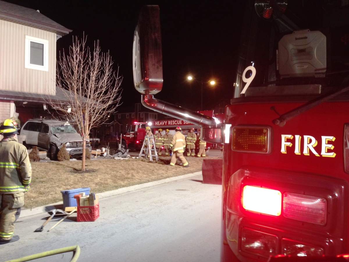 Emergency crews respond to reports of a vehicle colliding with a home in the 200 block of Auburn Bay Boulevard S.E. on Thursday, March 26th, 2015.
