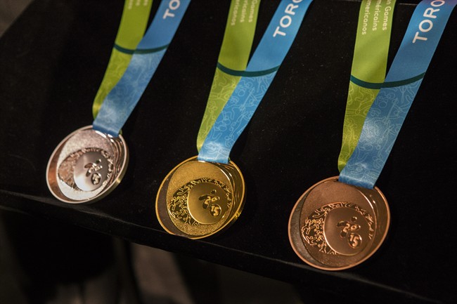 Toronto 2015 Pan Am Games silver, gold and bronze medals are displayed  in Toronto on March 3, 2015. 
