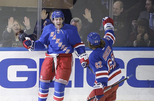 New York Rangers' Lee Stempniak (12) celebrates after scoring a goal against the Arizona Coyotes in New York on Thursday. The Winnipeg Jets made another move for their playoff run by acquiring winger Lee Stempniak from the New York Rangers for young forward Carl Klingberg on Sunday.