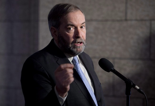 NDP Leader Tom Mulcair speaks with the media following caucus in Ottawa on March 25, 2015. Tom Mulcair says an NDP government would take tax benefits from those who need them least and give them to those who need them most. 