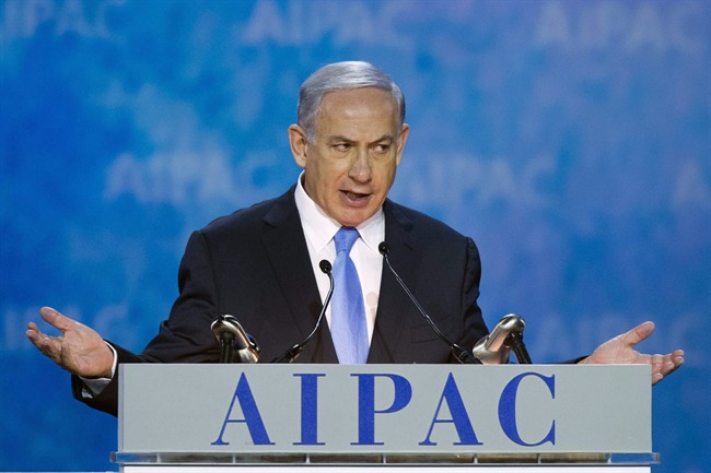 Israeli Prime Minister Benjamin Netanyahu gestures at the 2015 American Israel Public Affairs Committee Policy Conference. Netanyahu took a conciliatory tone as he prepared to form new government.