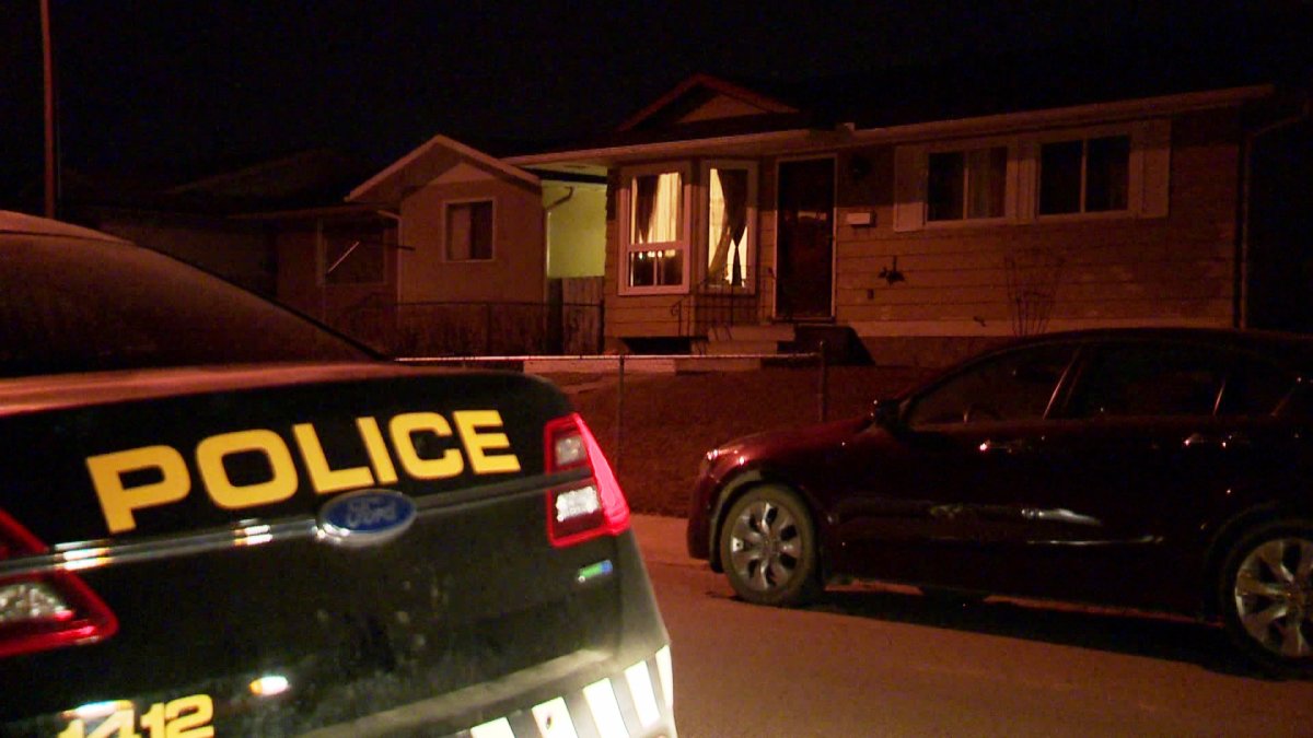 Calgary Police investigate a shooting a home along Doverbrook Road S.E. on Friday, March 27, 2015.