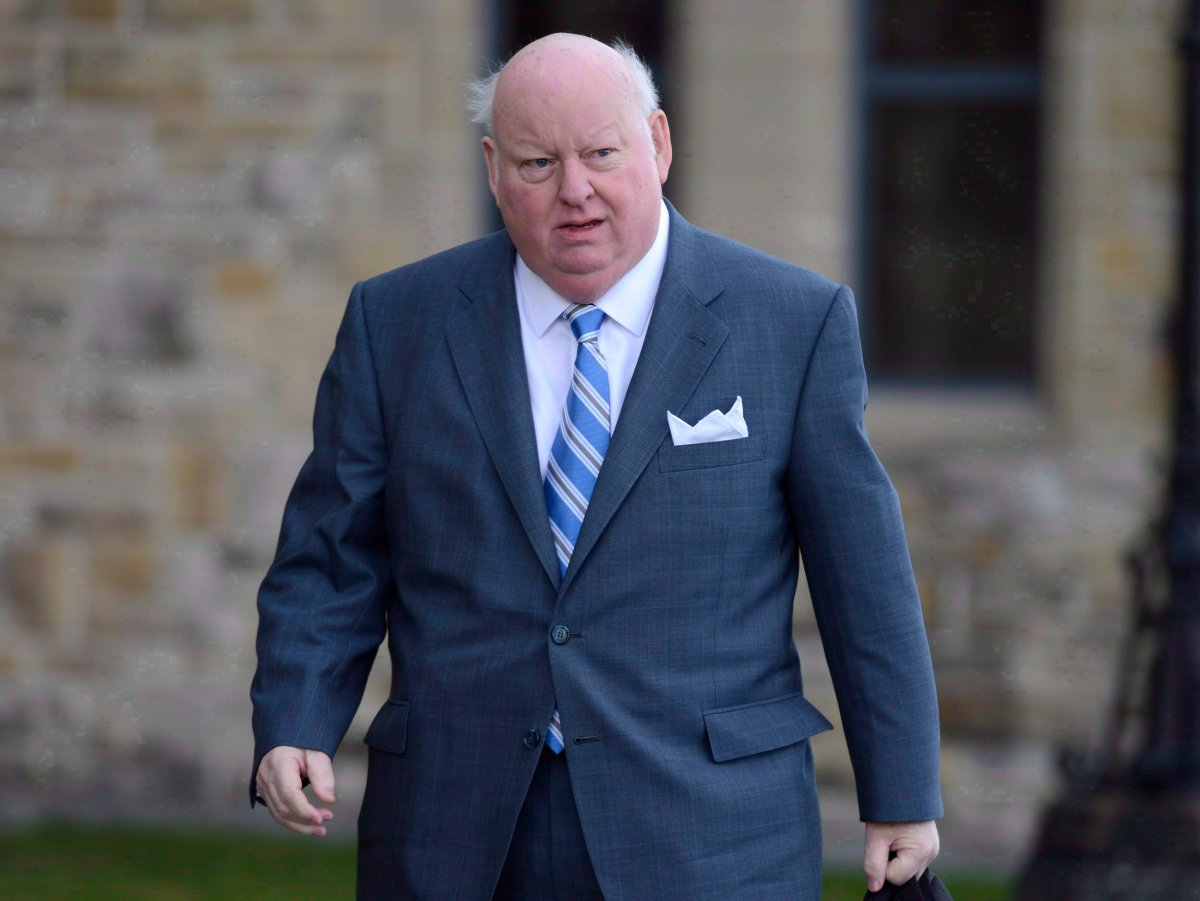 Sen. Mike Duffy arrives to the Senate on Parliament Hill in Ottawa, Monday, October 28, 2013. THE CANADIAN PRESS/Adrian Wyld.