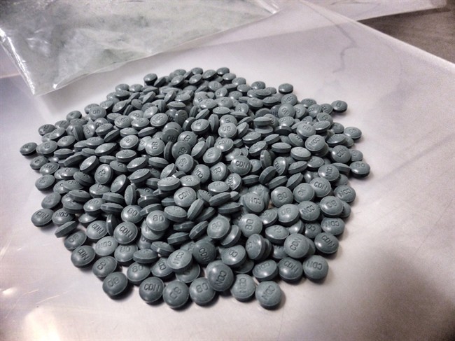 Fentanyl pills are shown in a handout photo. Police say organized crime groups have been sending a potentially deadly drug through British Columbia to Alberta and Saskatchewan using hidden compartments in vehicles.