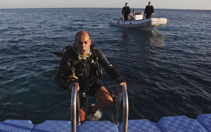 Assistant Secretary of the South Sinai Governate, General Ahmed Saleh leaves the water after diving in the sea at the site of the fatal shark attack of a German tourist, in the Red Sea resort of Sharm el-Sheik, Egypt Tuesday, Dec. 7, 2010.