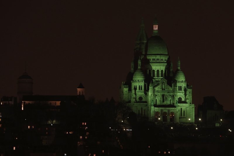 The Sacre-Coeur Basilica in Paris is illuminated in green to celebrate Saint Patrick's Day, on March 17, 2015. 