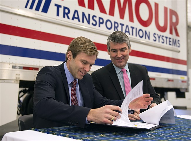 Nova Scotia Premier Stephen McNeil, right, and New Brunswick Premier Brian Gallant are pictured in Dartmouth on March 24, 2015. Both premiers' approval ratings declined since March, according to Angus Reid.