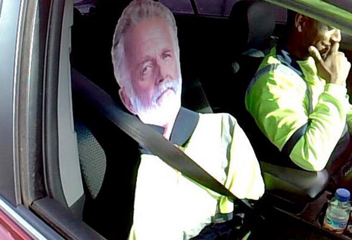 A Washington State man was ticketed Monday for driving in a carpool lane with a cardboard cutout of "The Most Interesting Man in the World.".