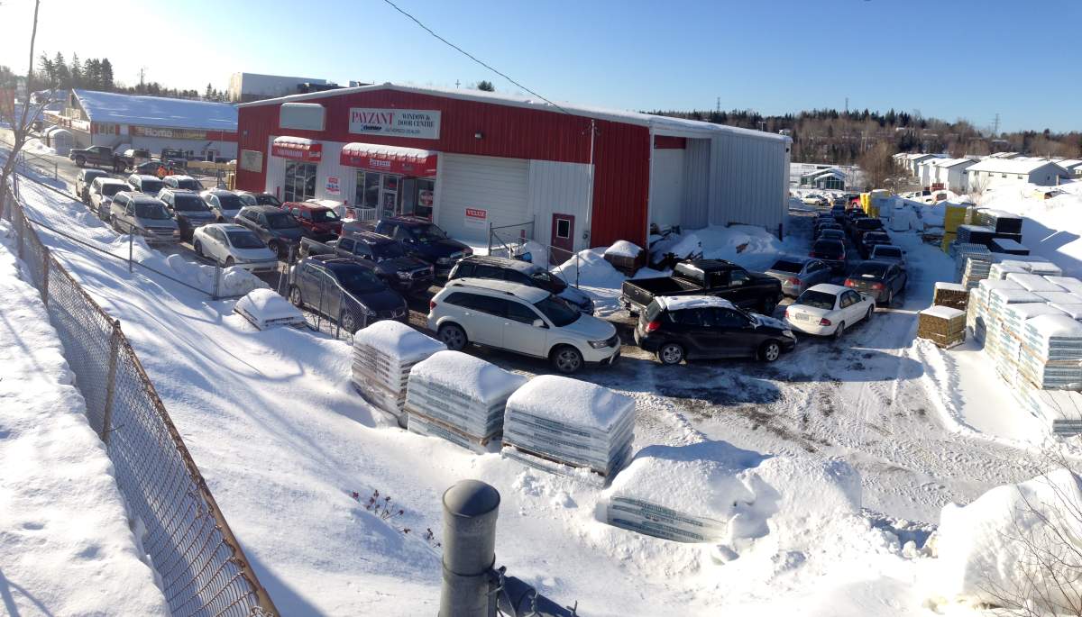More than a hundred vehicles line up waiting to get wood pellets.