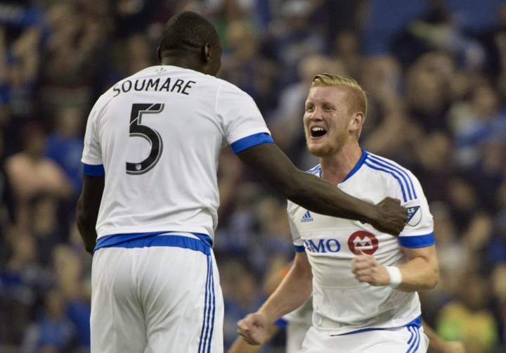 Montreal Impact Bakary Soumare, left, and Calum Mallace celebrate their 1-1 tie against Pachuca FC in CONCACAF soccer action Tuesday, March 3, 2015 in Montreal. The teams tied the two-game aggregate goals series 3-3, but Montreal won on the away goals rule after drawing 2-2 at Pachuca in the first leg last week.