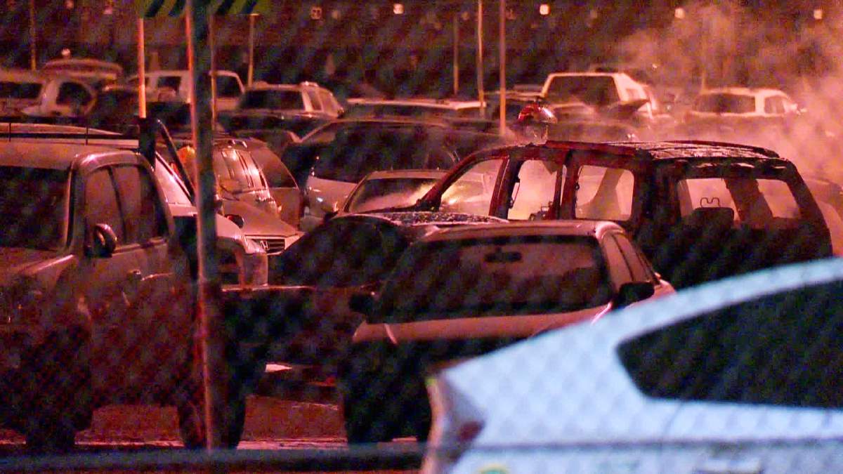 Smoke pours from a southeast impound lot where five vehicles were set on fire, on Monday, March 2nd, 2015.