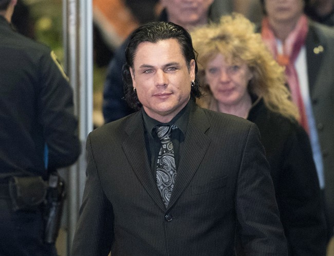 Patrick Brazeau leaves the Gatineau Courthouse for a break during the second day of his trial on Tuesday, March 24, 2015.