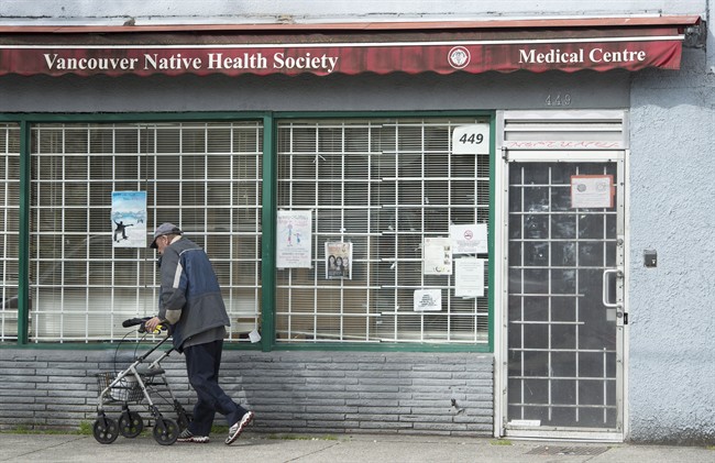 A man walks past the Vancouver Native Health Society in Vancouver, Saturday, March 28, 2015. An accounting firm and new tech outfit have paired to challenge problem-solvers from around the world to generate cost-effective ideas that might prove to be the magic elixir for the health care challenges facing First Nations. 