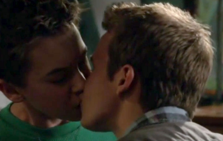 Hayden Byerly, left, and Gavin MacIntosh kiss in a scene from 'The Fosters.'.