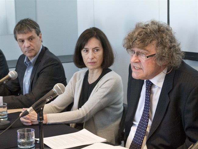 James Lockyer, right, lawyer for AIDWYC, speaks to reporters as Jean Delisle and Elen Delisle, son and daughter of former court of appeal judge Jacques Delisle, look on Friday, March 20, 2015 in Quebec City.