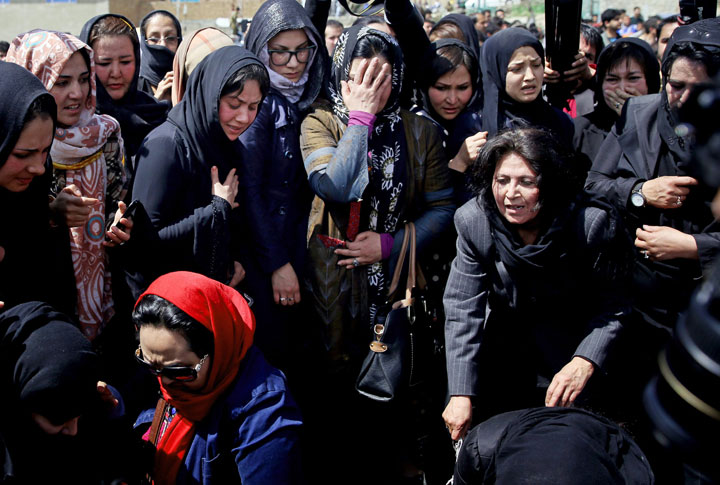 Civil society activists mourn during the funeral of 27-year-old Farkhunda, an Afghan woman who was beaten to death by a mob, in Kabul, Afghanistan, Sunday, March 22, 2015. 