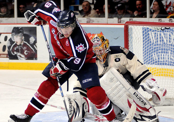 File photo: Saginaw Spirit's Kyle Bochek deflects the puck in front of Windsor Spitfires’ goaltender Andrew Engelage during third period OHL hockey action Sunday, March 1, 2009 in Windsor. 