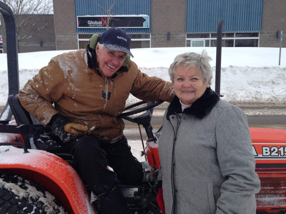 Larry and Margie McLaughlin embrace the snow.