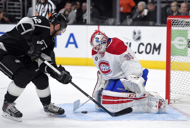 Los Angeles Kings right wing Marian Gaborik, left, of Slovakia, tries to get a shot in on Montreal Canadiens goalie Dustin Tokarski during the second period of an NHL hockey game, Thursday, March 5, 2015, in Los Angeles. 