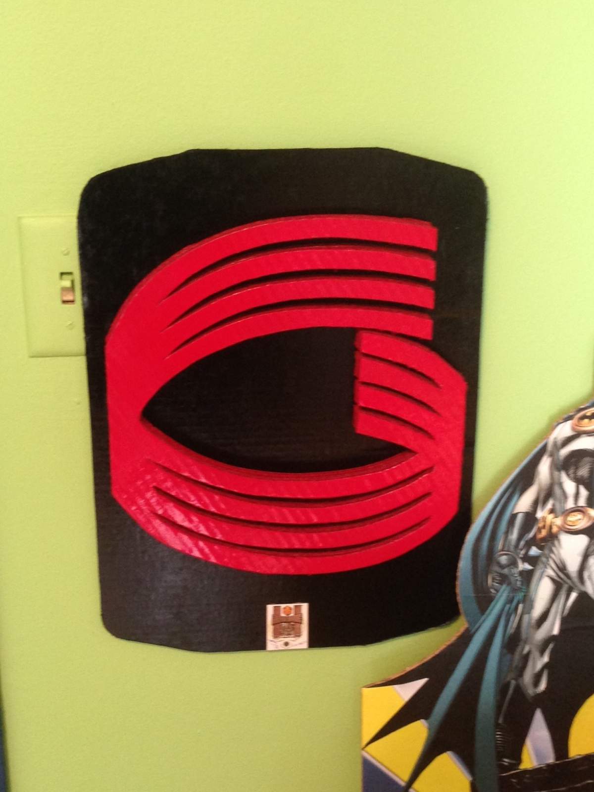 Vintage Global TV logo designed by Luanga Nuwame out of cardboard