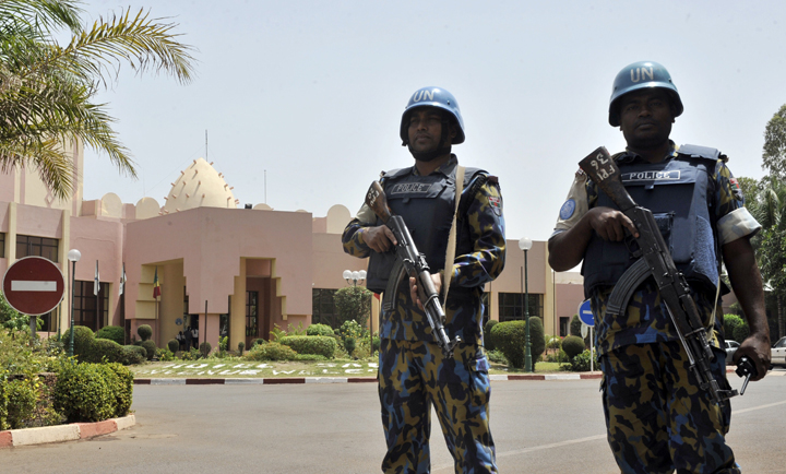 UN peacekeepers stand guard in Bamako, Mali, on March 8, 2015. 