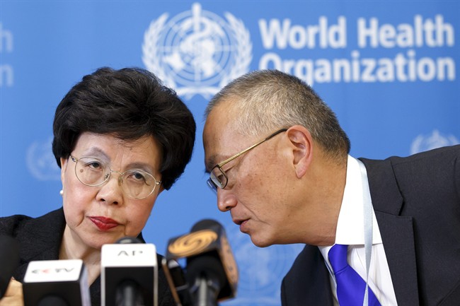In this Friday, Aug. 8, 2014 file photo, Director-General of the World Health Organization (WHO) Dr. Margaret Chan, left, and Assistant Director-General of Health Security Keiji Fukuda, right, confer during a news conference after an emergency meeting at the WHO headquarters in Geneva, Switzerland.