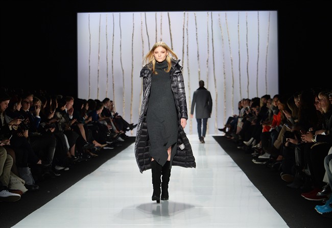 A model walks the runway for the Soia and Kyo collection during Toronto fashion week in Toronto on Thursday, March 26, 2015.