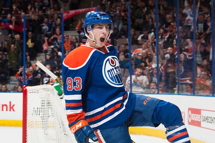 Ryan Nugent-Hopkins #93 of the Edmonton Oilers celebrates after scoring the game winning goal in overtime against the Philadelphia Flyers on March 21, 2015 at Rexall Place in Edmonton, Alberta, Canada. 